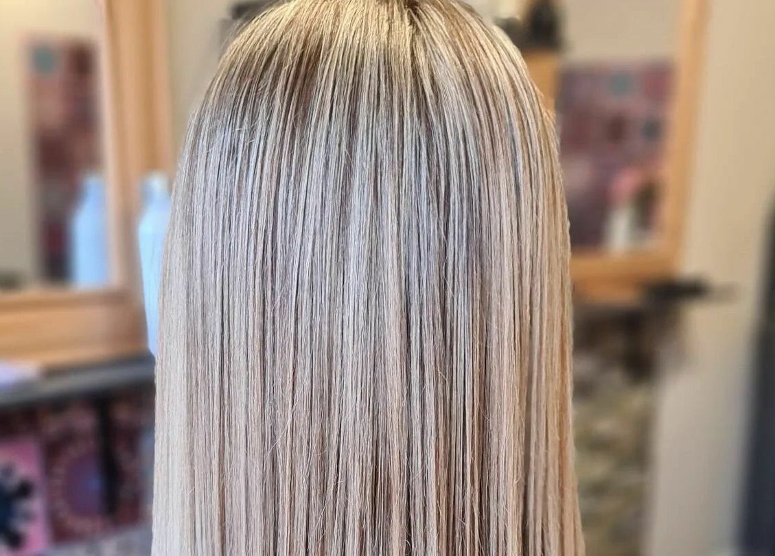 Smooth blonde hair styled at Xanadu in Wolston, England, GB, showcasing expert salon techniques.