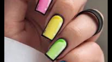 Colorful nail art at mkrnails in Kippax, England, GB, featuring pink, yellow, green, and black designs.