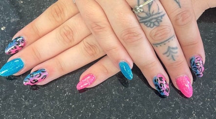 Colorful and intricate nail art at mkrnails&beauty academy in Kippax, England, GB featuring pink and blue designs.