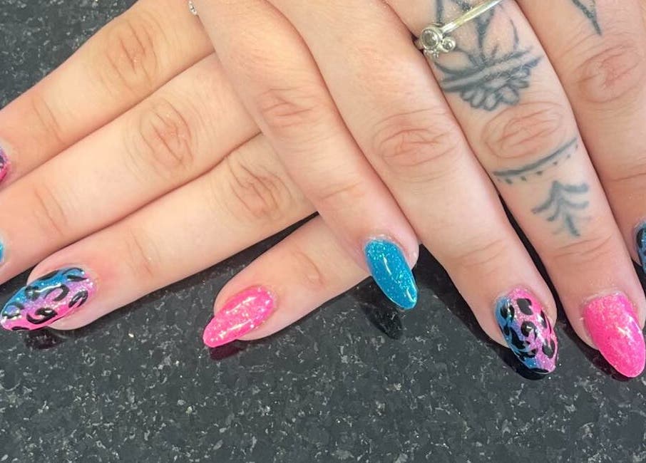 Stylish pink and blue nail art at mkrnails&beauty academy in Kippax, England, GB. Perfect for trendsetters.