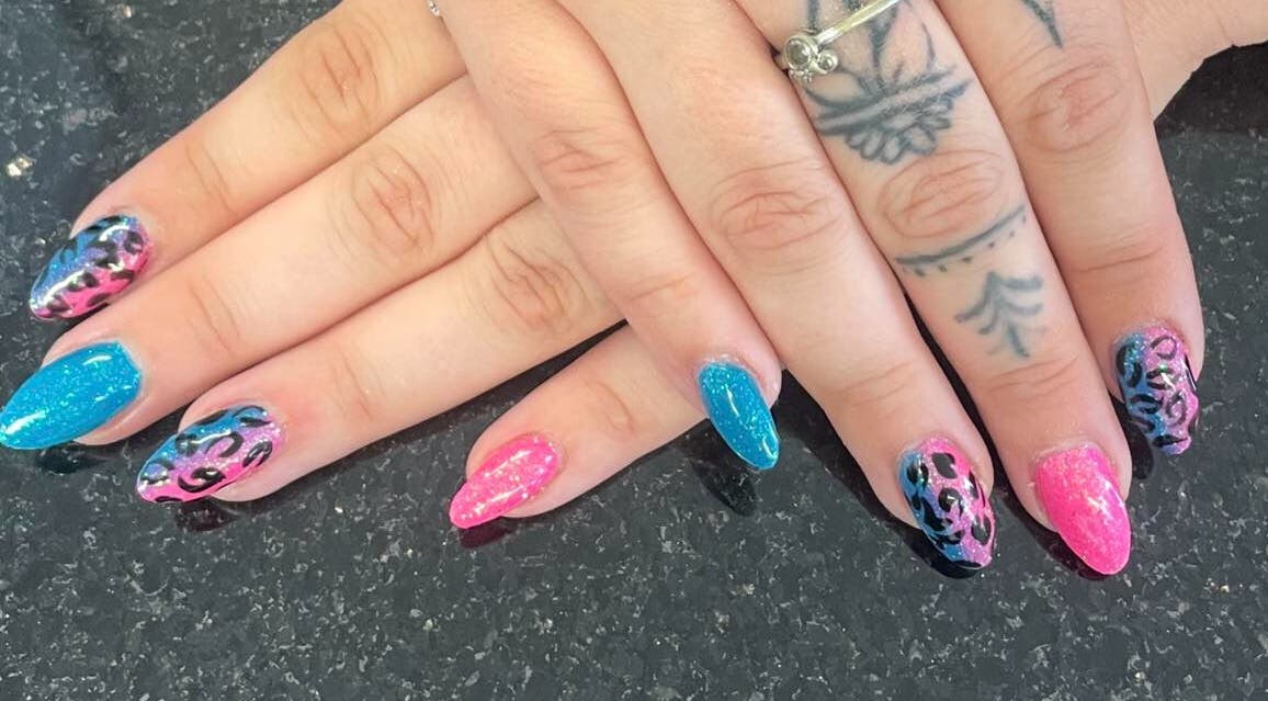Stylish pink and blue nail art at mkrnails&beauty academy in Kippax, England, GB. Perfect for trendsetters.