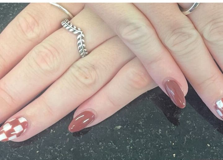 Elegant nail design at mkrnails&beauty academy, Kippax, England, GB. Featuring chic brown and white patterns.