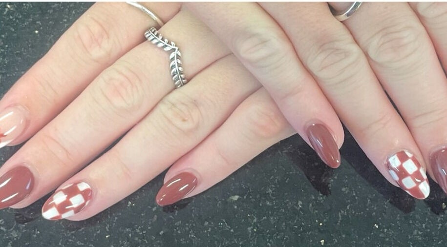 Elegant nail design at mkrnails&beauty academy, Kippax, England, GB. Featuring chic brown and white patterns.