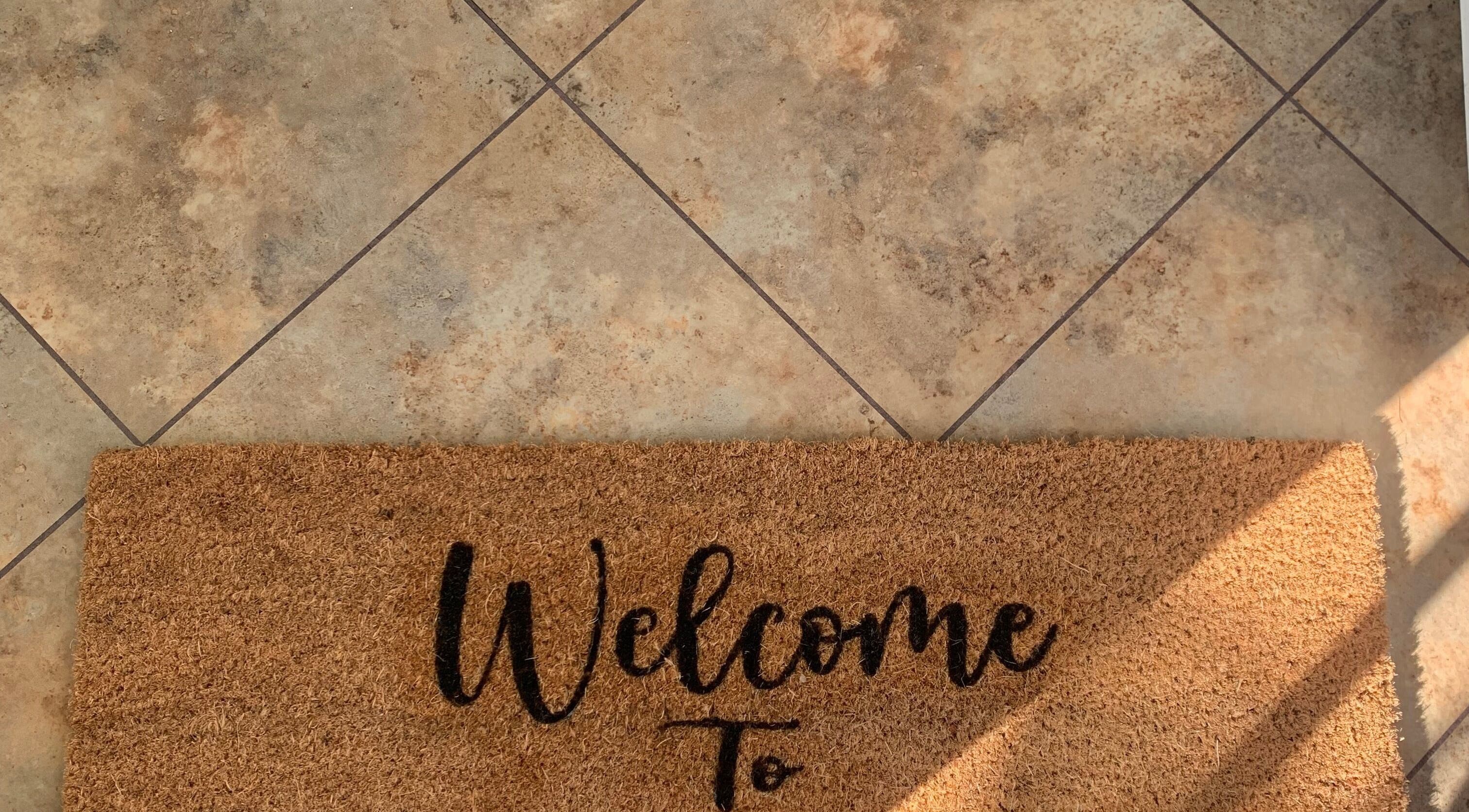 Welcome mat at Copper Cuts, Reading, England, GB entrance.