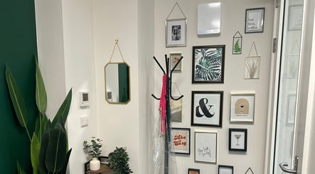 Stylish entryway with framed art at Morgan Mc Adams Hairdressing, The M Lounge @Phenix salon suites, Nottingham, England.