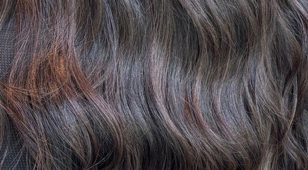 Lustrous wavy hair at Morgan Mc Adams Hairdressing in Nottingham, England, GB.