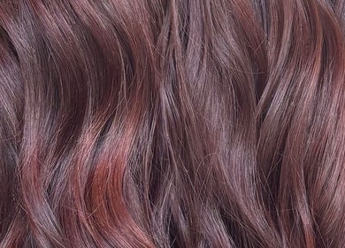 Lustrous brunette waves styled at Morgan Mc Adams Hairdressing, Nottingham, England, GB.
