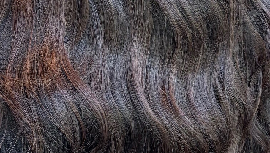Close-up of styled brunette hair waves at Morgan Mc Adams Hairdressing, Nottingham, England, GB.