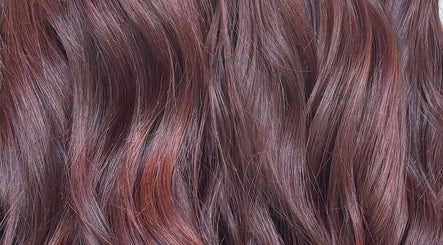 Glossy, auburn hair styled at Morgan Mc Adams Hairdressing, Nottingham, England, GB.