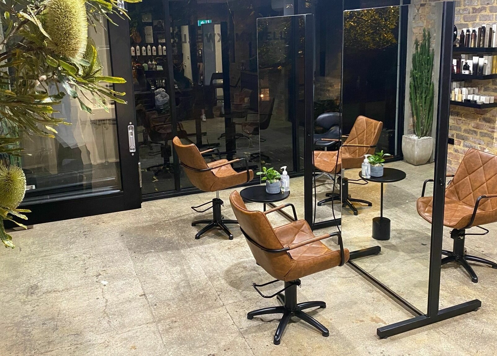 Stylish salon interior with leather chairs at Marc & Maxwell, Surry Hills, New South Wales, AU.