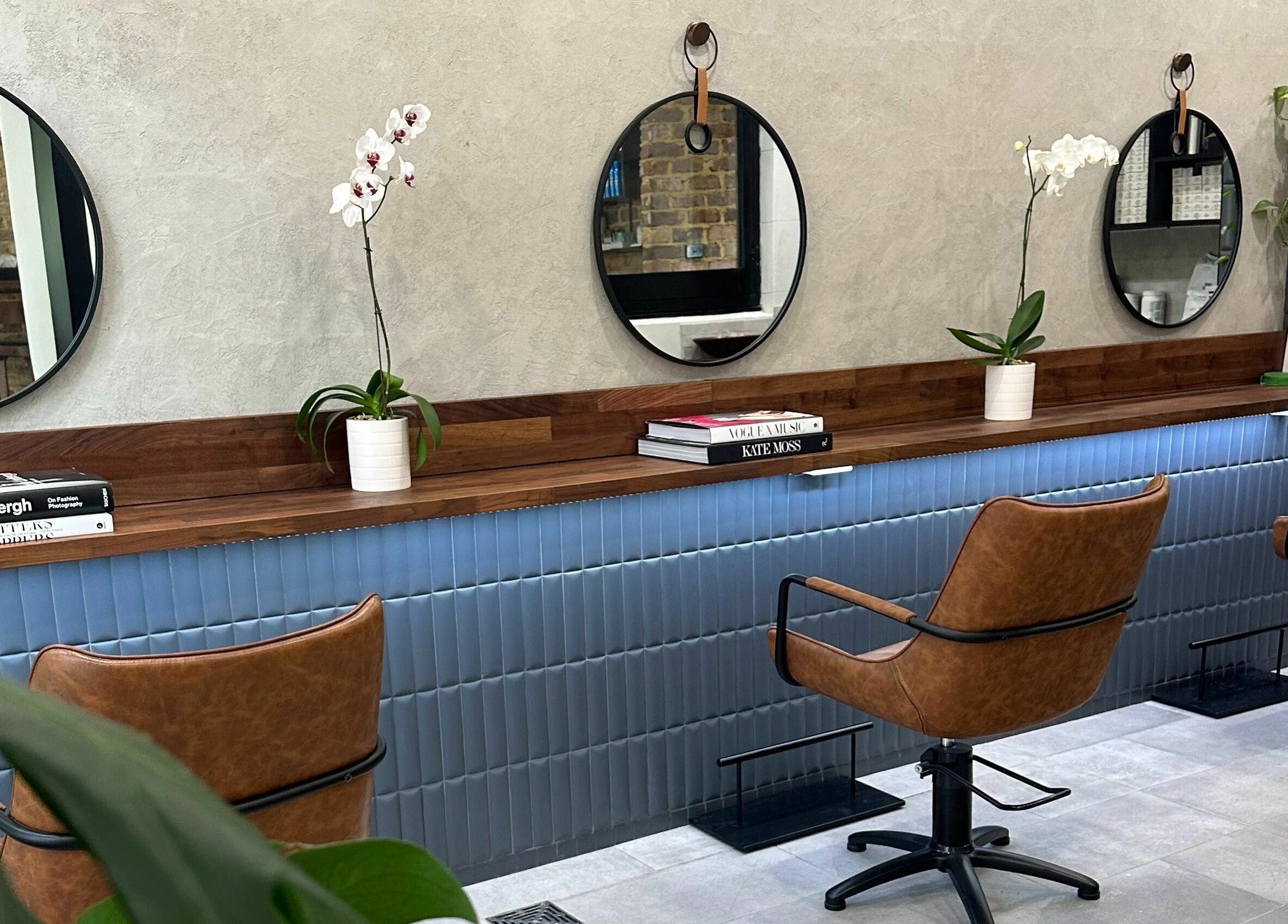 Marc & Maxwell salon interior with modern chairs and mirrors in Surry Hills, New South Wales, AU.