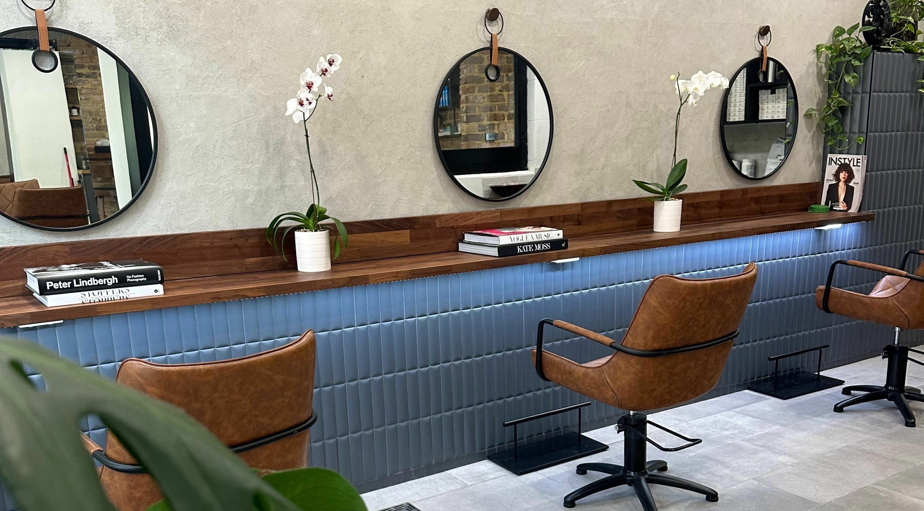 Marc & Maxwell salon interior with modern chairs and mirrors in Surry Hills, New South Wales, AU.