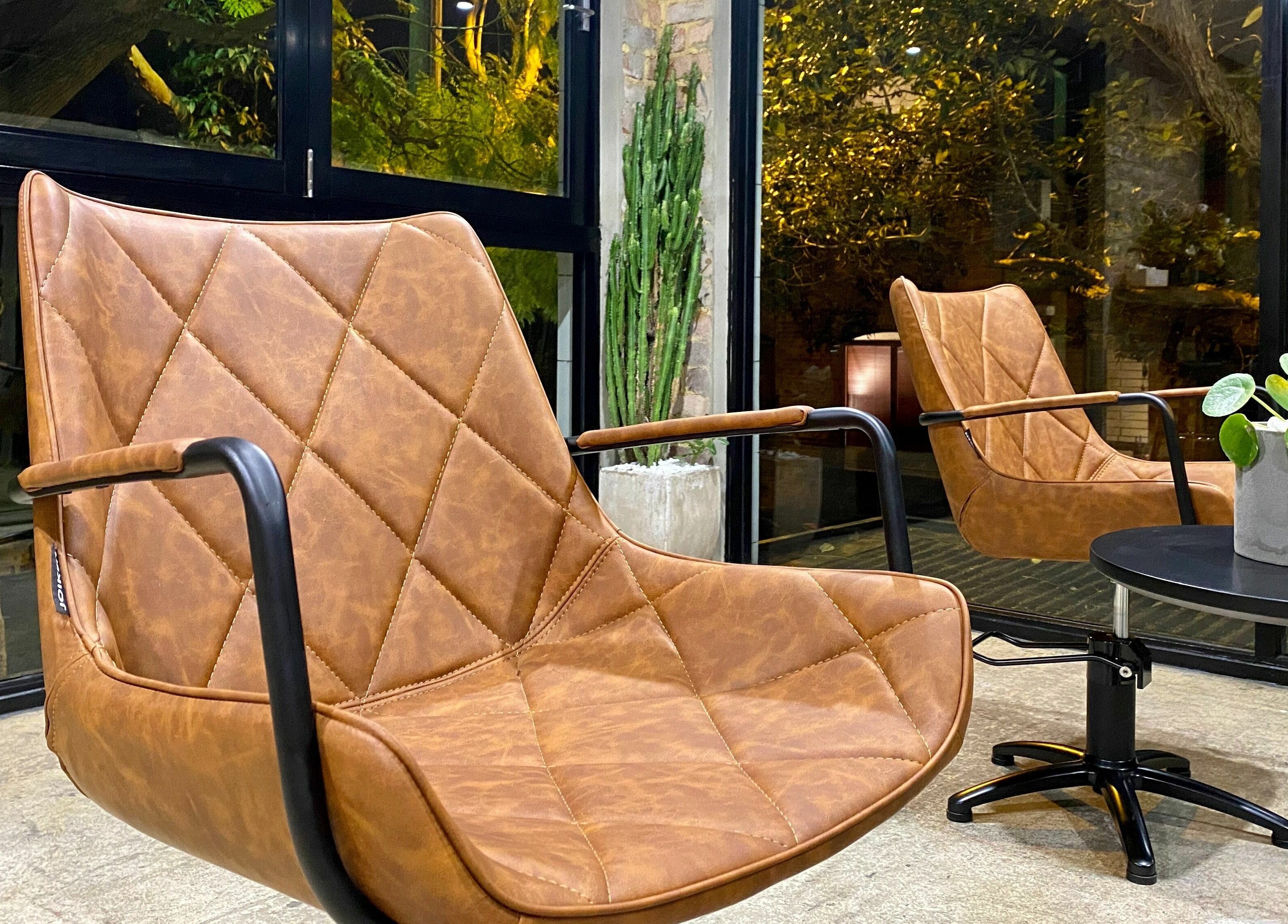 Elegant leather chairs at Marc & Maxwell, Surry Hills, New South Wales, AU, offering a relaxing ambiance.