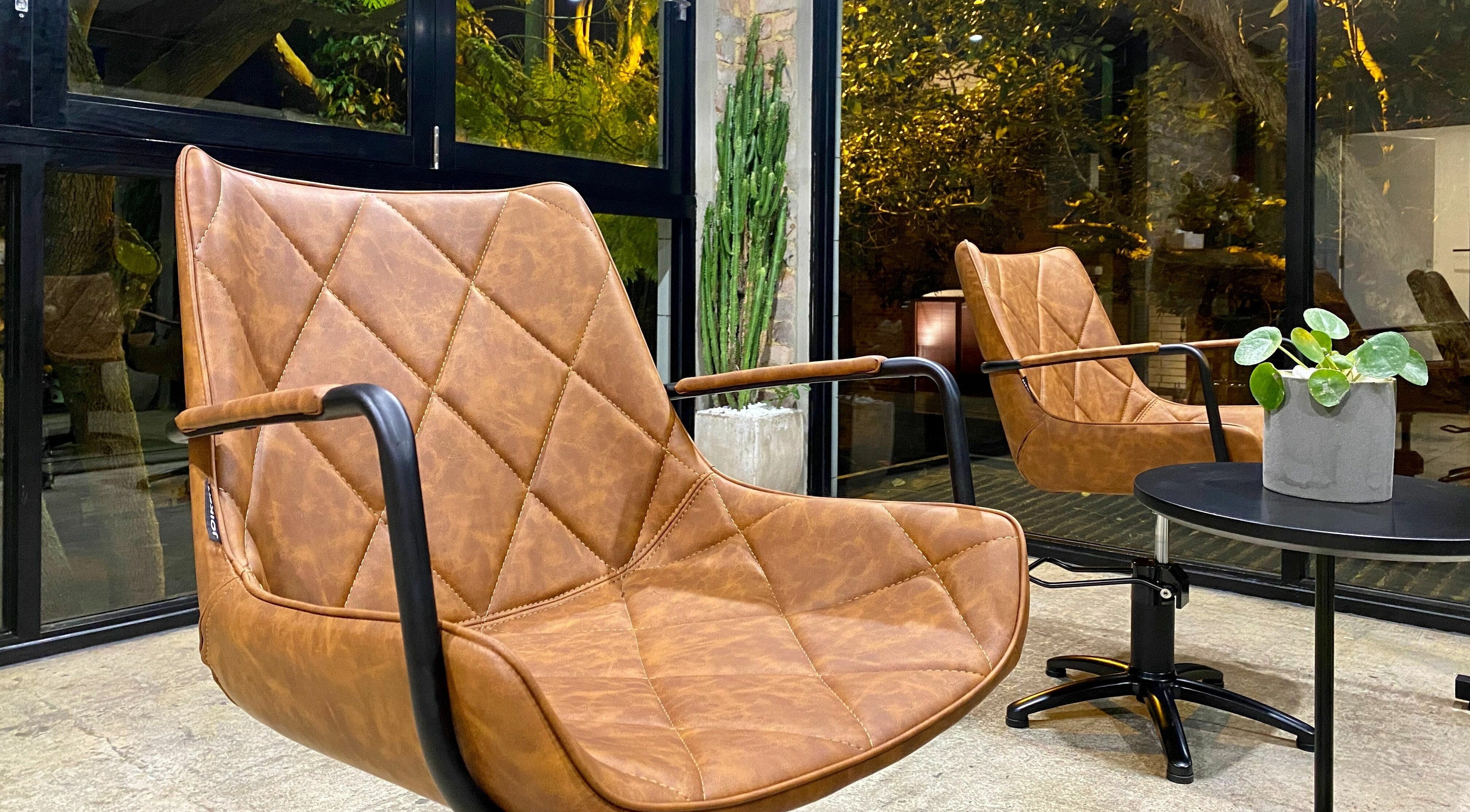 Elegant leather chairs at Marc & Maxwell, Surry Hills, New South Wales, AU, offering a relaxing ambiance.