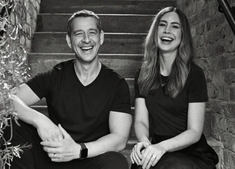 Owners of Marc & Maxwell delight on rustic stairs, Surry Hills, New South Wales, AU.