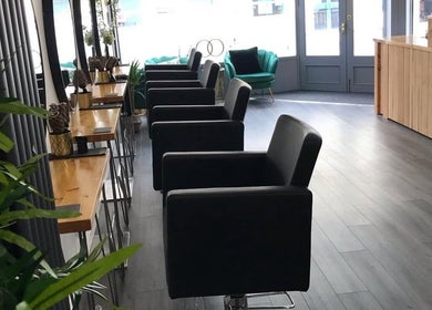 Modern salon chairs and decor at thehideaway_hayley in Bourne, England, GB, offering a chic beauty experience.
