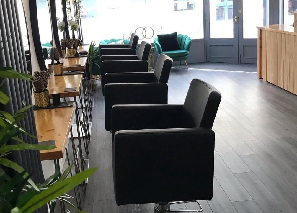 Modern salon chairs and decor at thehideaway_hayley in Bourne, England, GB, offering a chic beauty experience.