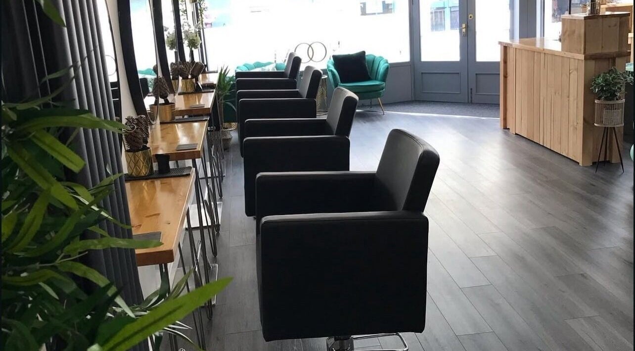 Modern salon chairs and decor at thehideaway_hayley in Bourne, England, GB, offering a chic beauty experience.