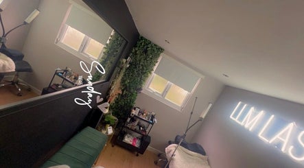 Interior of LLM Lashes in North Shields, England, GB featuring a serene setup with lush greenery and elegant lighting.