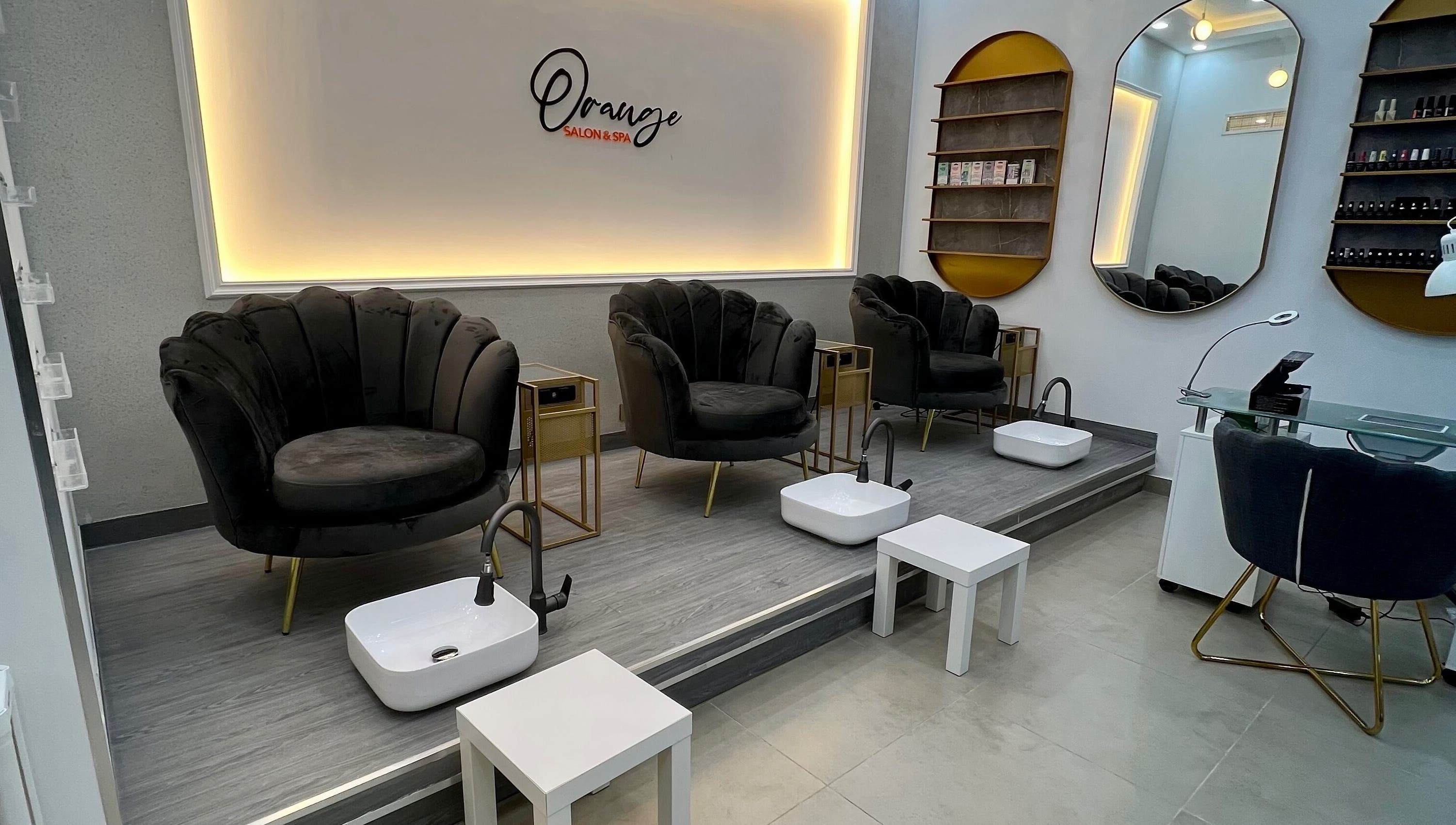 Luxurious pedicure chairs at Orange Spa, Muscat Governorate, OM, offering a relaxing atmosphere.