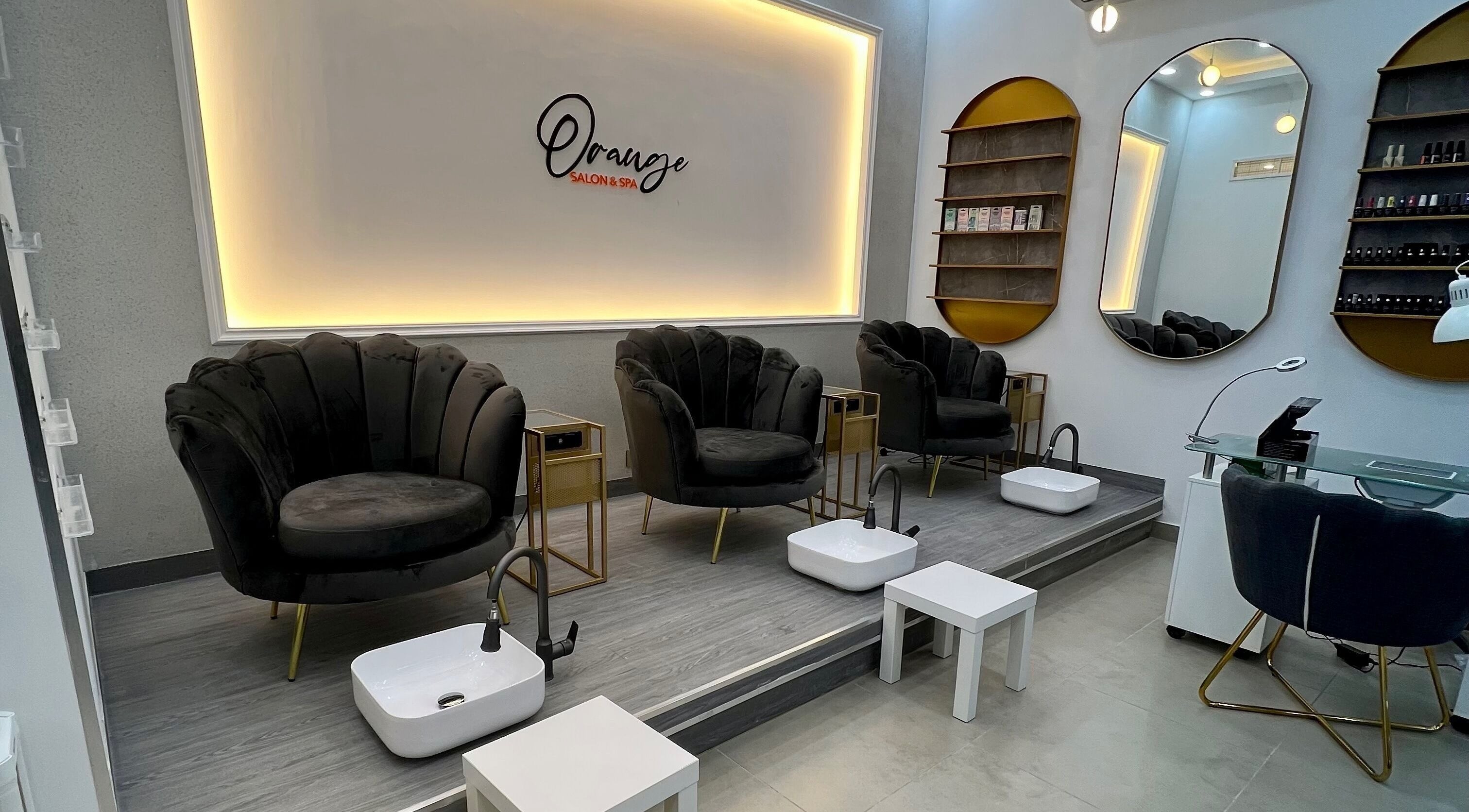 Luxurious pedicure chairs at Orange Spa, Muscat, Muscat Governorate, OM. Sleek design for ultimate relaxation.