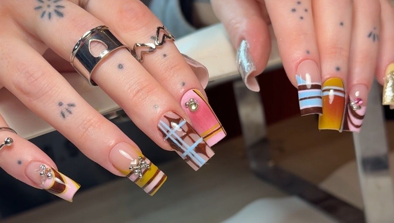 Intricate nail art at Solo Studio Nails & Education, Amble, England, GB showcasing vibrant and creative designs.