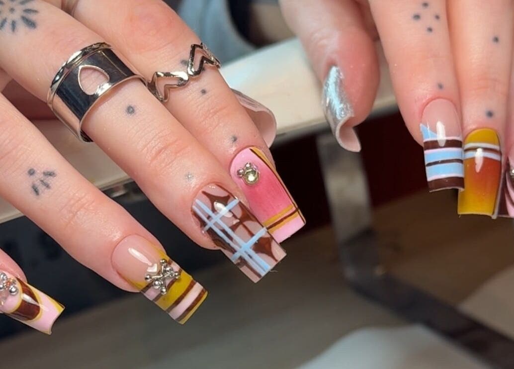 Intricate nail art at Solo Studio Nails & Education, Amble, England, GB showcasing vibrant and creative designs.