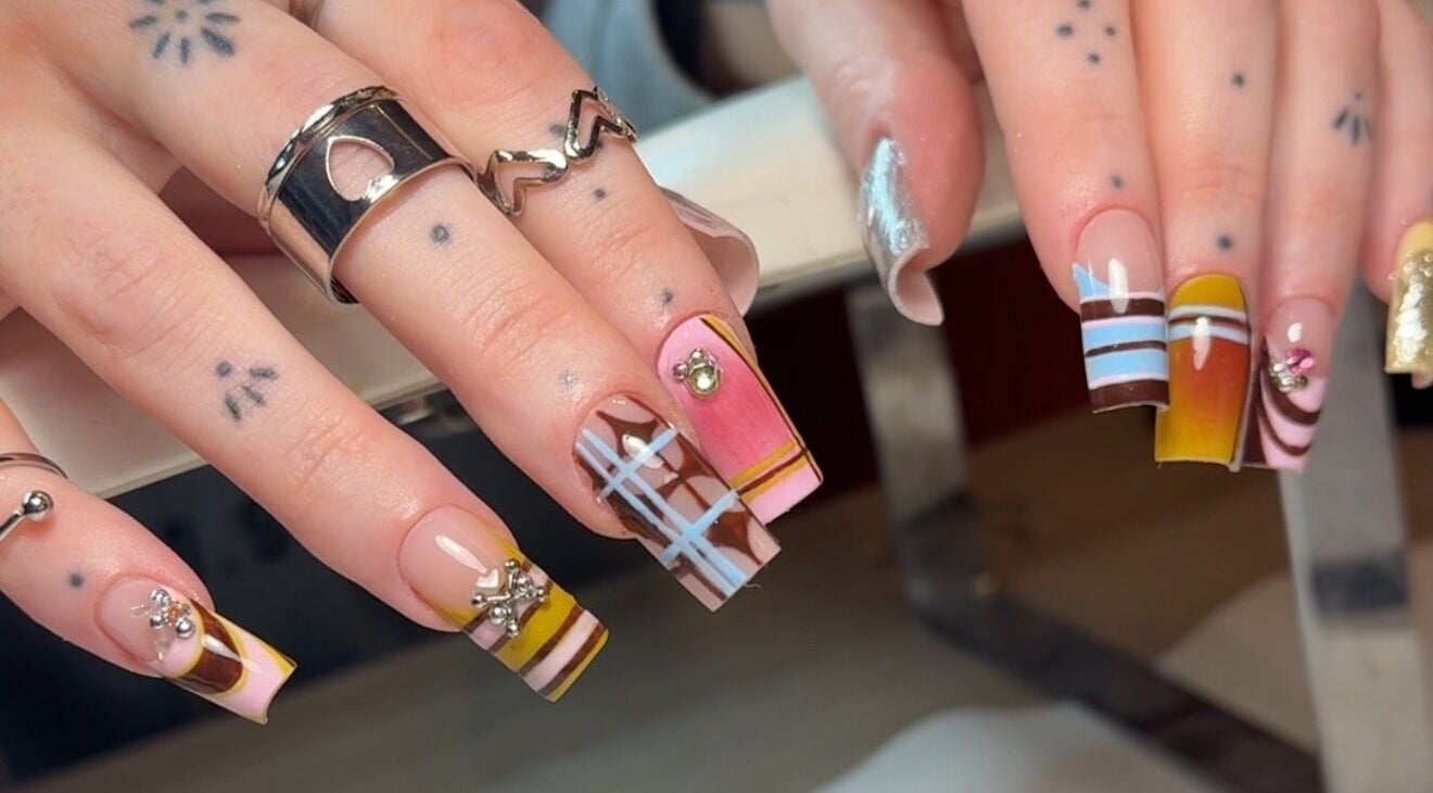 Intricate nail art at Solo Studio Nails & Education, Amble, England, GB showcasing vibrant and creative designs.