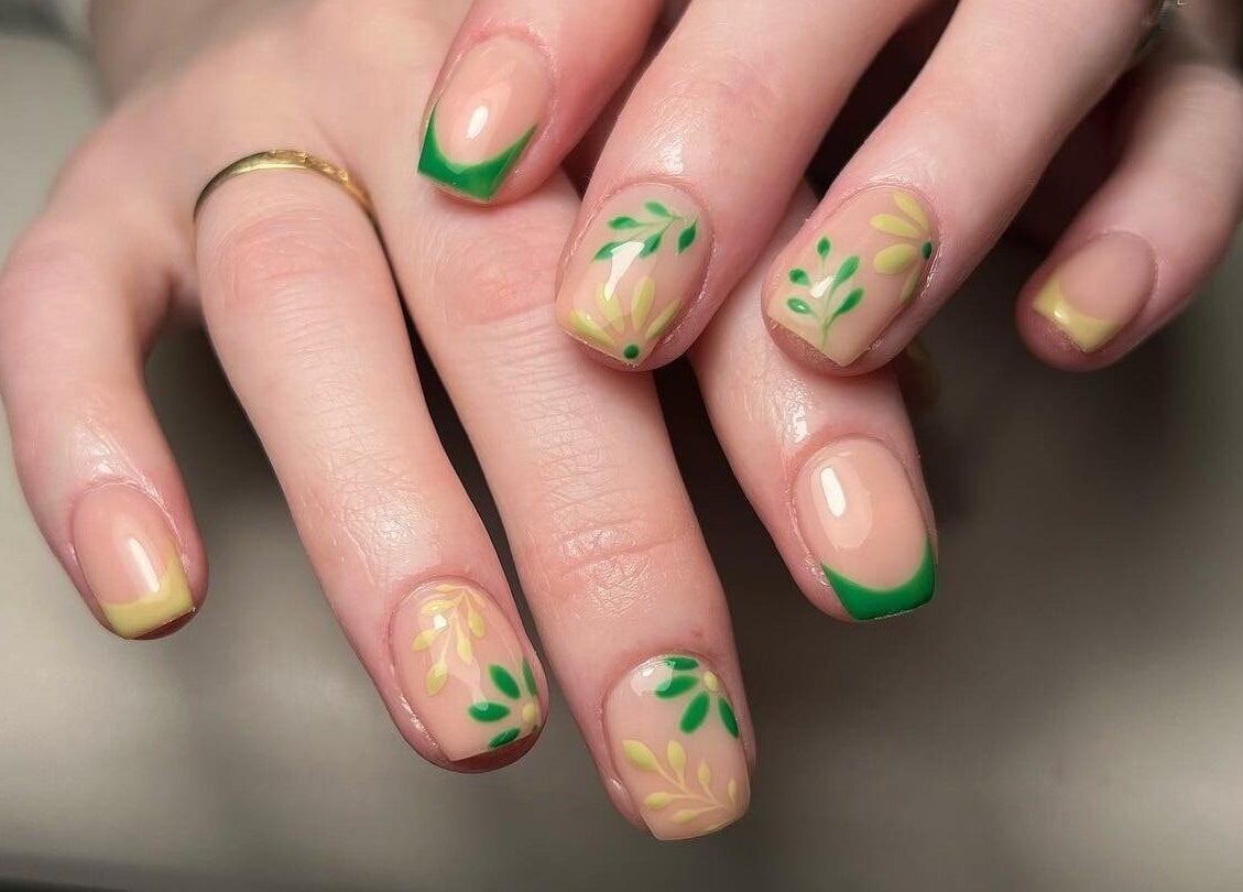 Elegant floral nail art with green accents at Ivy Studio, Shaw, England, GB, showcasing trendy nail designs.