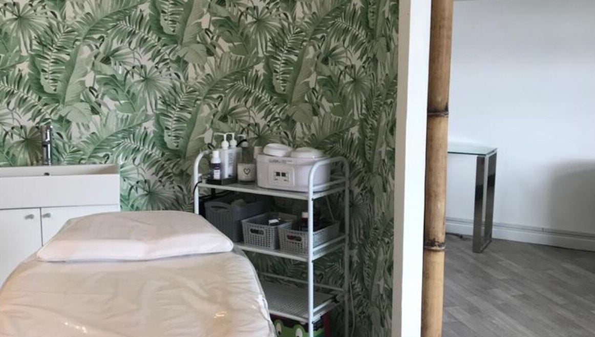 Platinum Beauty treatment room with lush tropical wallpaper in Littleborough, England, GB.