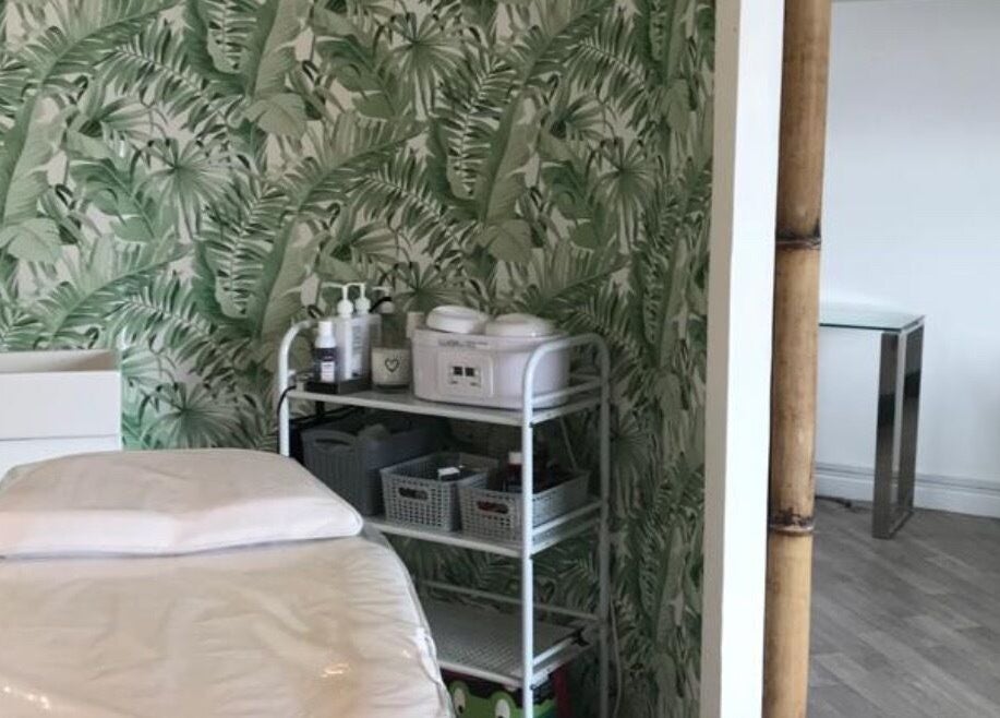 Platinum Beauty treatment room with lush tropical wallpaper in Littleborough, England, GB.
