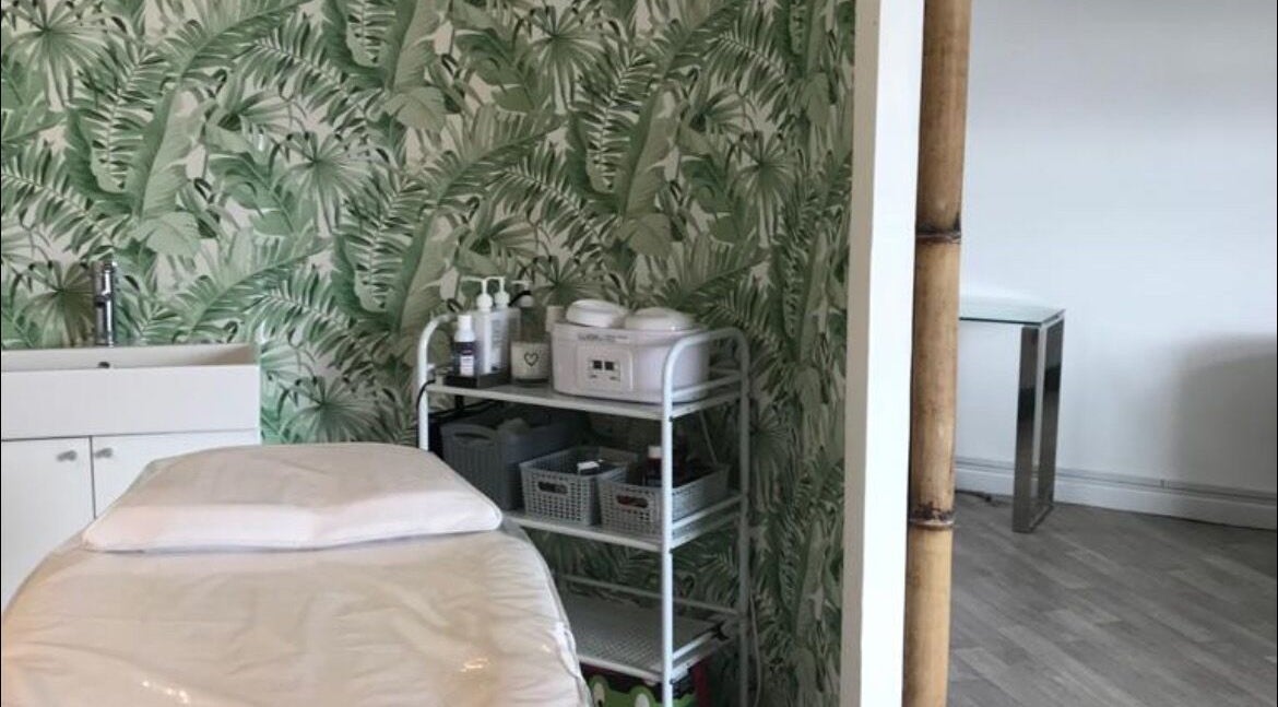 Platinum Beauty treatment room with lush tropical wallpaper in Littleborough, England, GB.