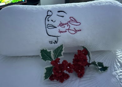 Elegant embroidered towel at Beauty and Secret by IC, Philipsburg, Sint Maarten, SX with floral decoration.