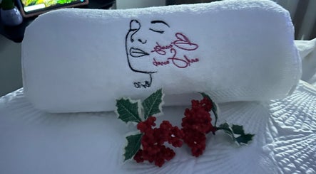 Elegant embroidered towel at Beauty and Secret by IC, Philipsburg, Sint Maarten, SX with floral decoration.