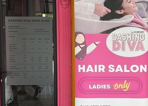 Entrance of Dashing Diva Shah Alam in Selangor, MY, featuring vibrant signage.