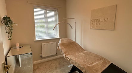 Cozy treatment room at Cheshire Brow Bar in Winsford, England, GB, featuring a comfortable chair and ambient decor.