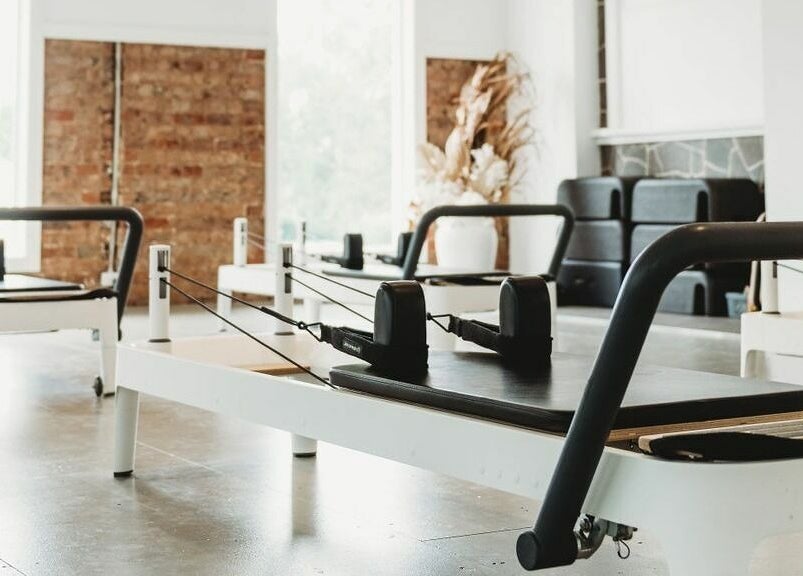 Pilates studio setup at Slow by Seed in Orange, New South Wales, AU with elegant reformer machines.