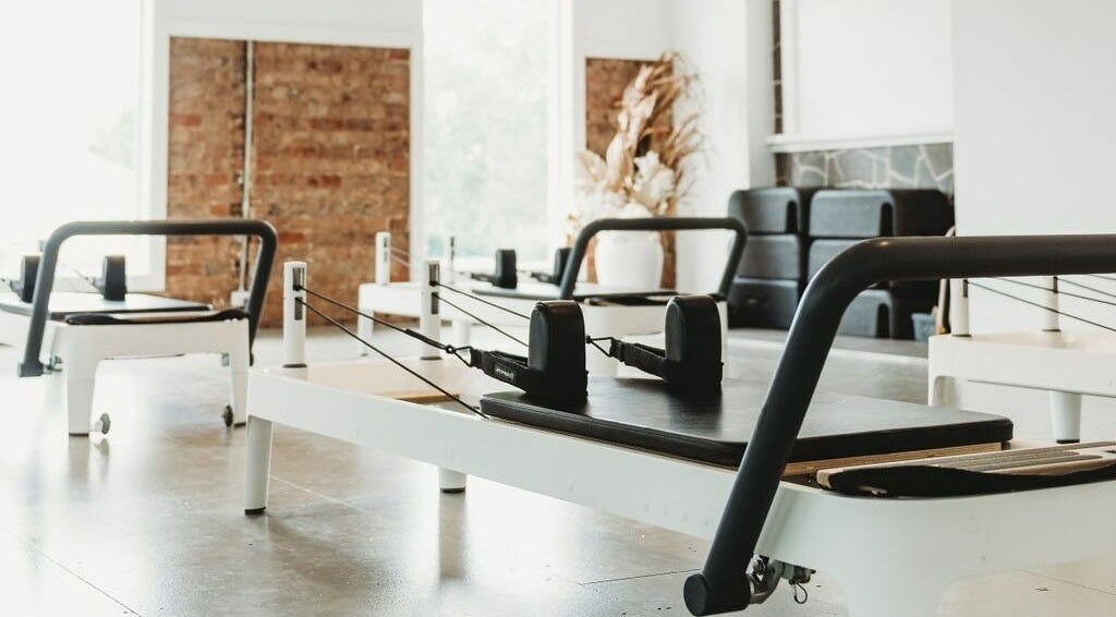 Pilates studio setup at Slow by Seed in Orange, New South Wales, AU with elegant reformer machines.