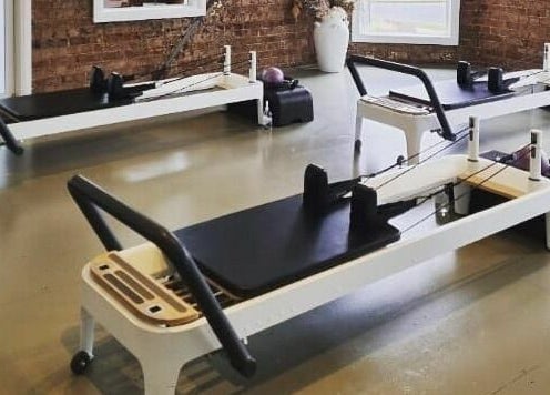 Modern Pilates reformers at Slow by Seed, Orange, New South Wales, AU offering a serene workout space.