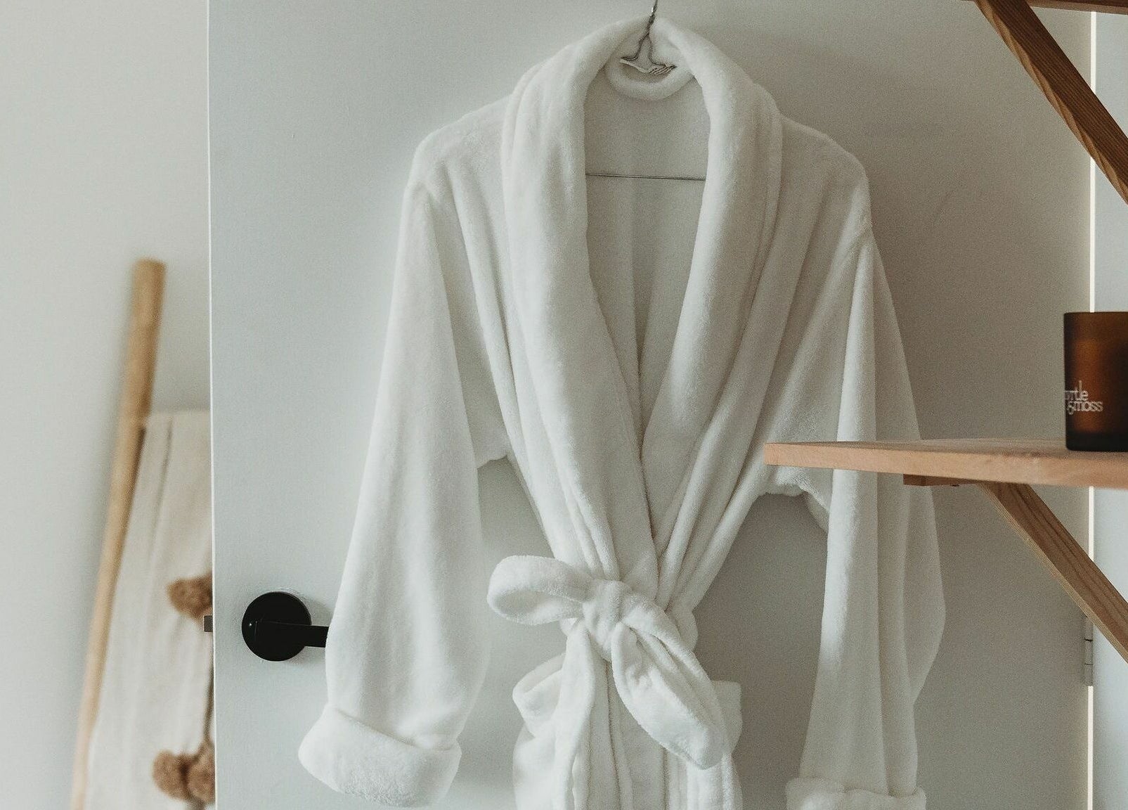 White robe hanging in tranquil space at Slow by Seed, Orange, New South Wales, AU.