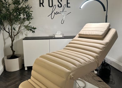 Relaxing treatment room at COCO ROSE BEAUTY, St Austell, England, GB features a plush recliner and ambient lighting.