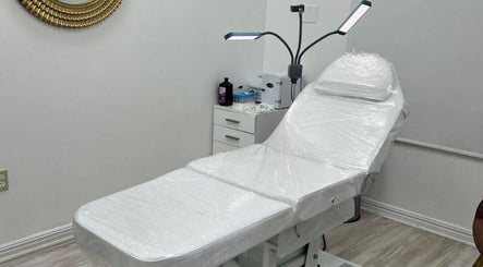 Treatment room at Harmony Medical Spa in Doral, Florida, US with a sleek white chair and modern decor.
