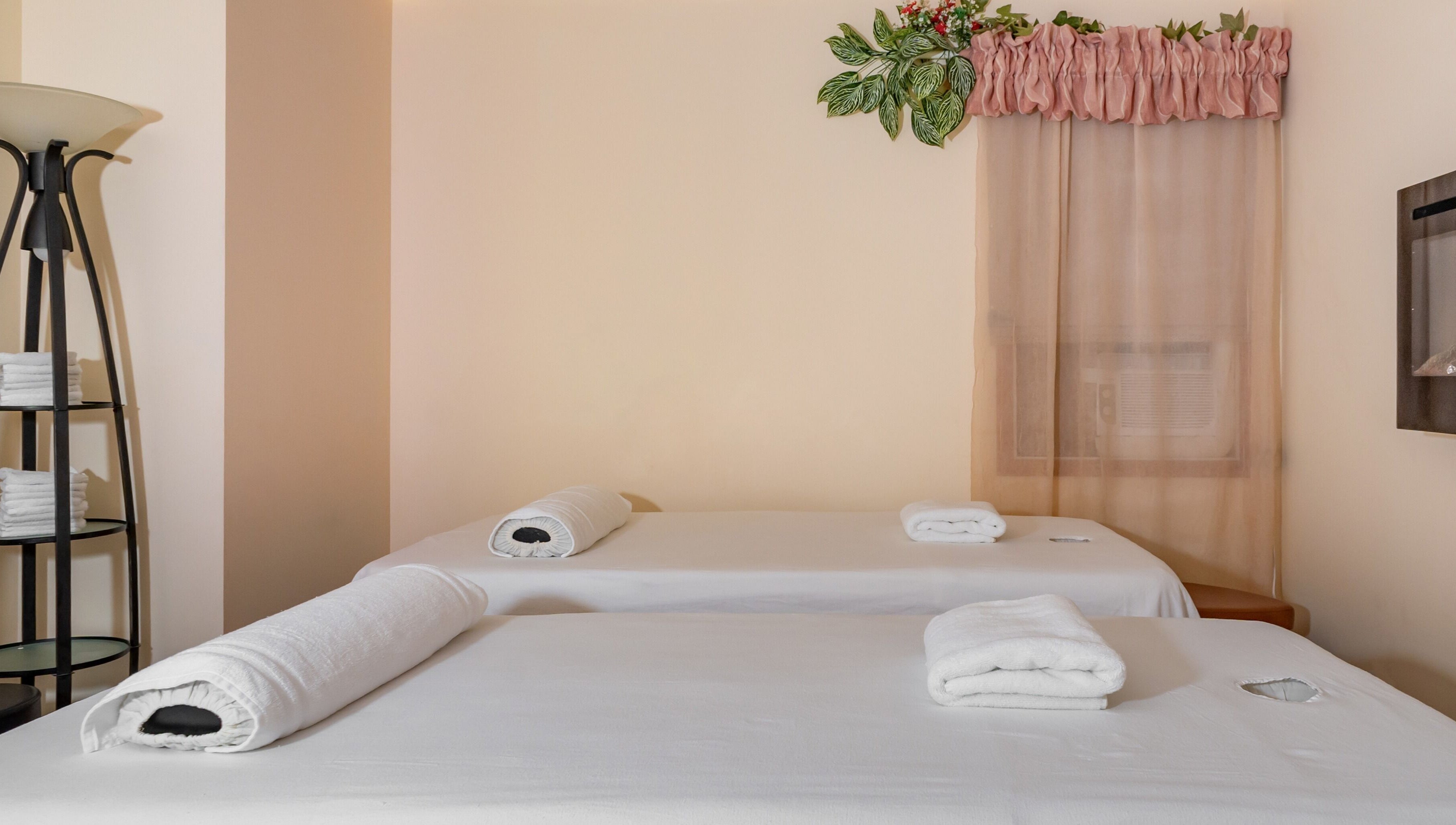 Tranquil massage room at Massage by Anna Ltd, Red Deer, Alberta, CA with two prepared tables.