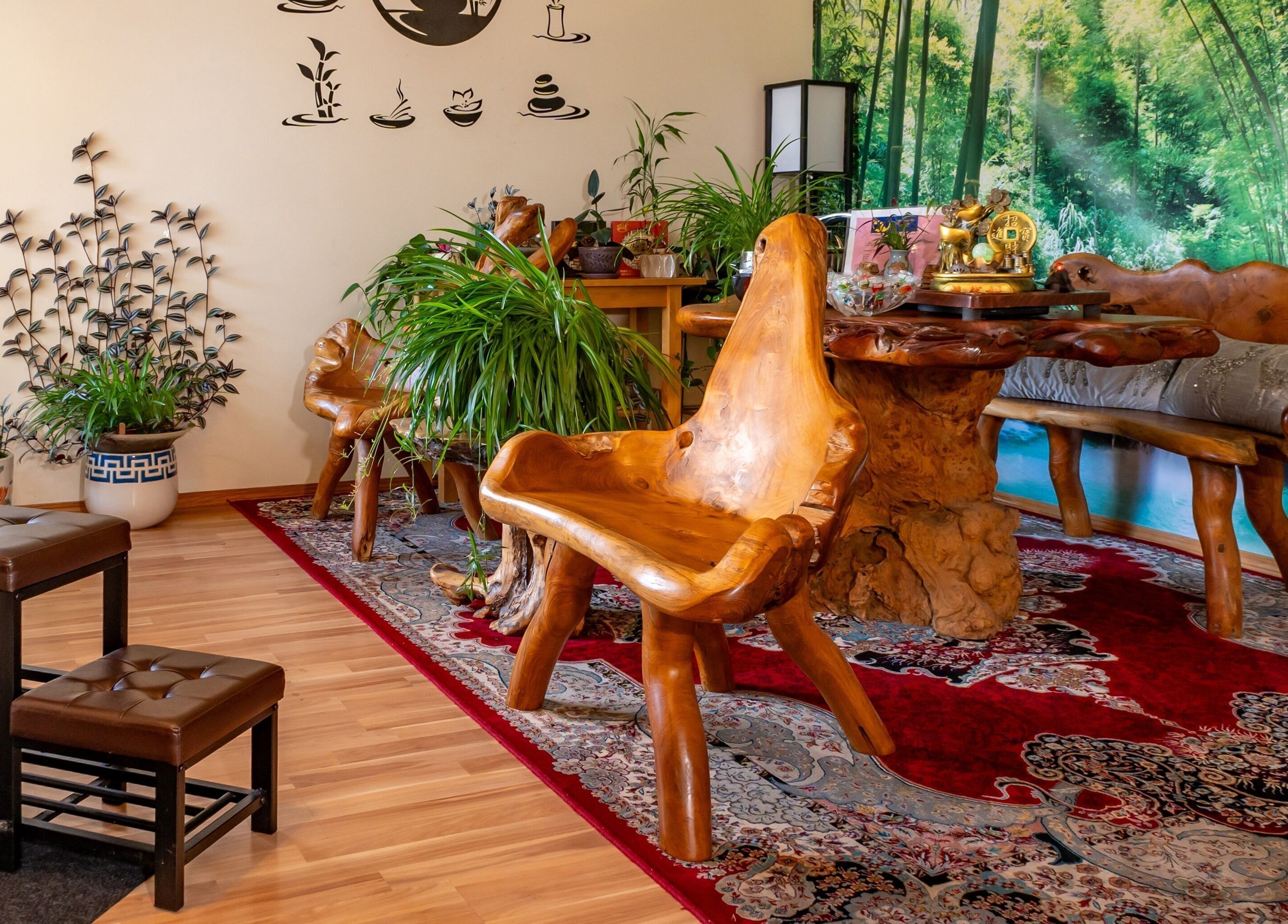 Elegant wooden seating area with lush plants at Massage by Anna Ltd, Red Deer, Alberta, CA.