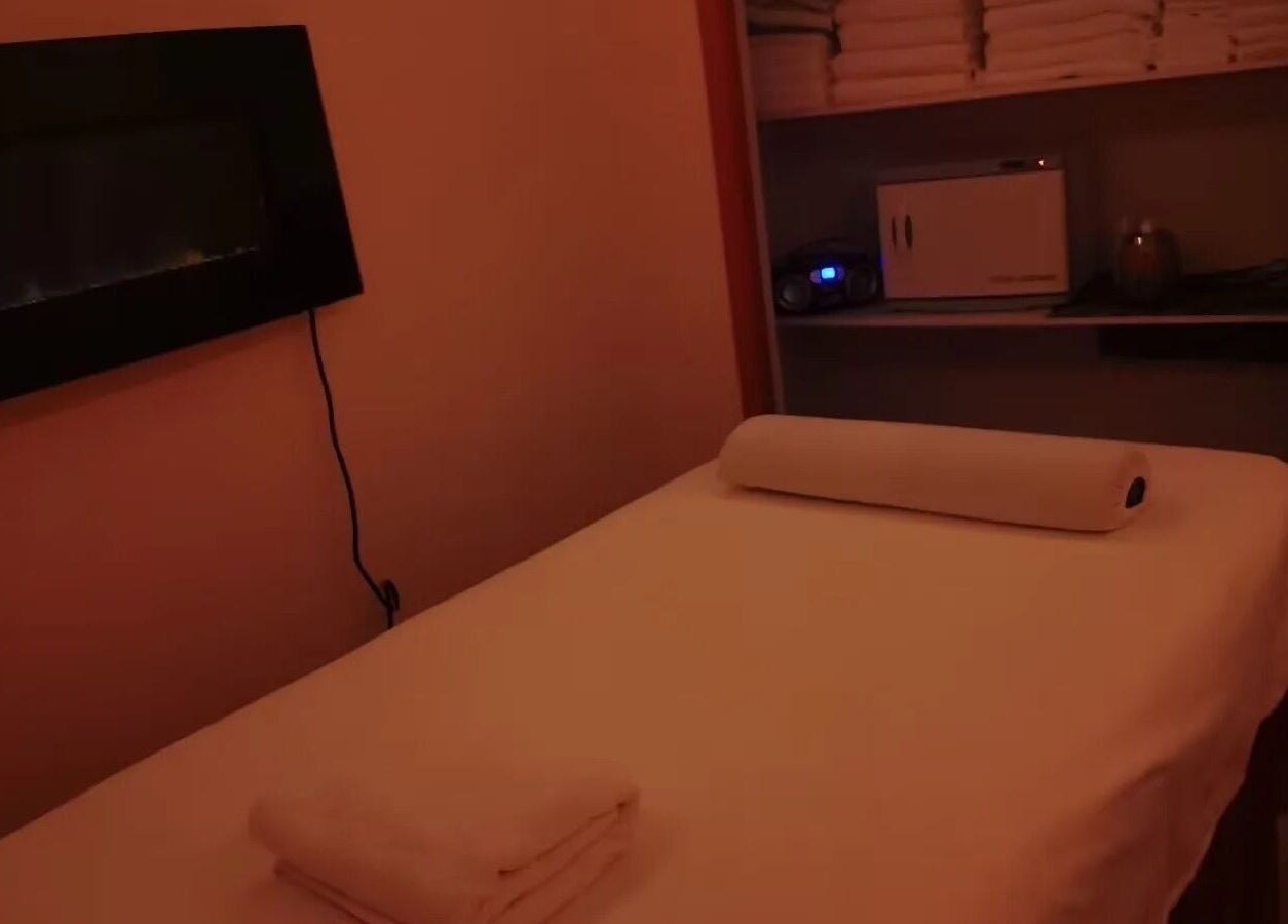 Cozy massage room at Massage by Anna Ltd, Red Deer, Alberta, CA, featuring a dimly lit, serene environment.