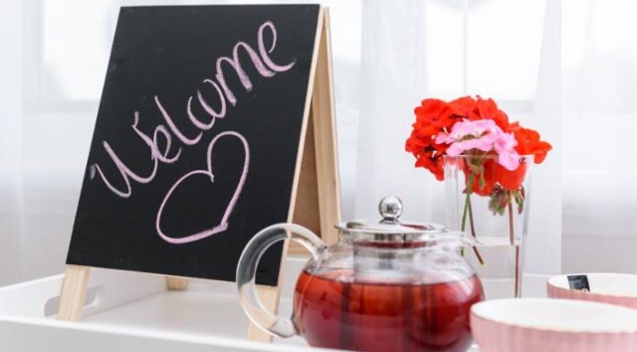 Chalkboard welcome sign with flowers and teapot at Brow Rehab n Skin Gym, Baldivis, Western Australia, AU.