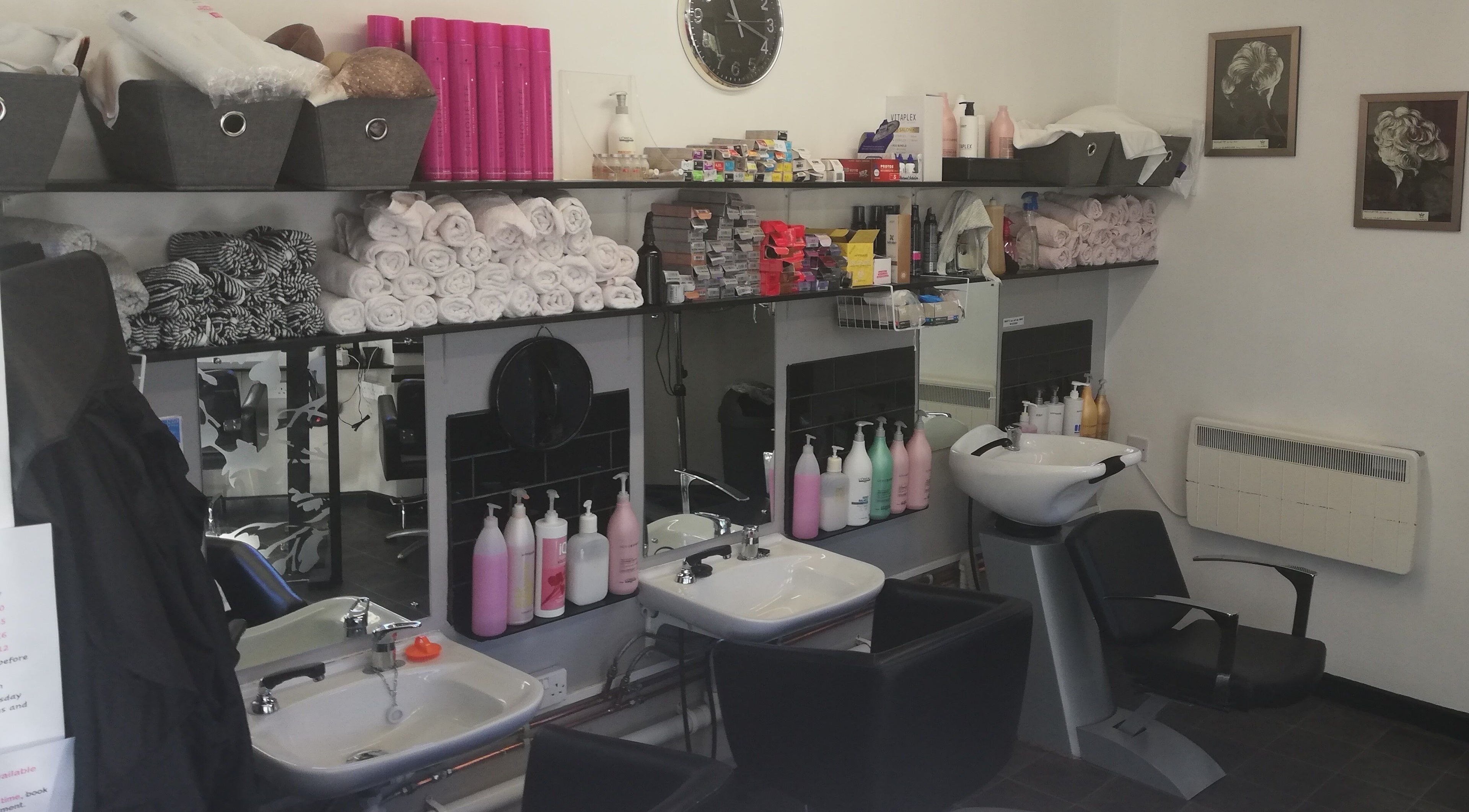 Country Style salon interior with hair stations in South Brent, England, GB, featuring towels and products.