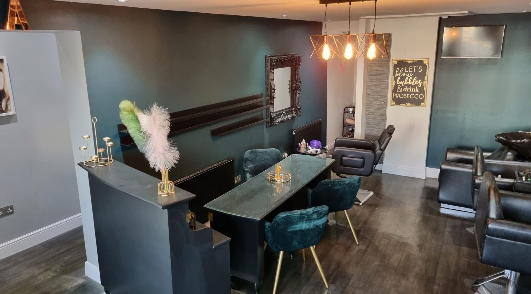 Elegant interior of LA Beauty salon in Glasgow, Scotland, GB, featuring plush chairs and stylish decor.