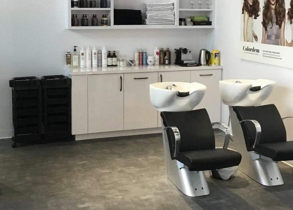 Modern hair washing station at Maneland in Ottawa, Ontario, CA, with sleek design and professional products.