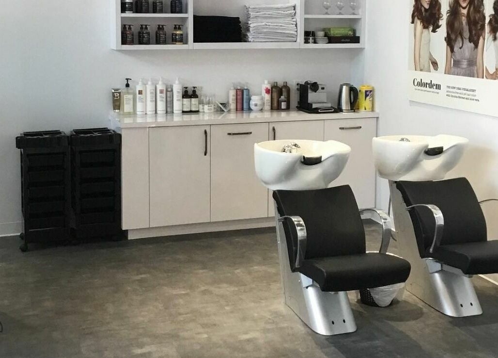 Modern hair washing station at Maneland in Ottawa, Ontario, CA, with sleek design and professional products.